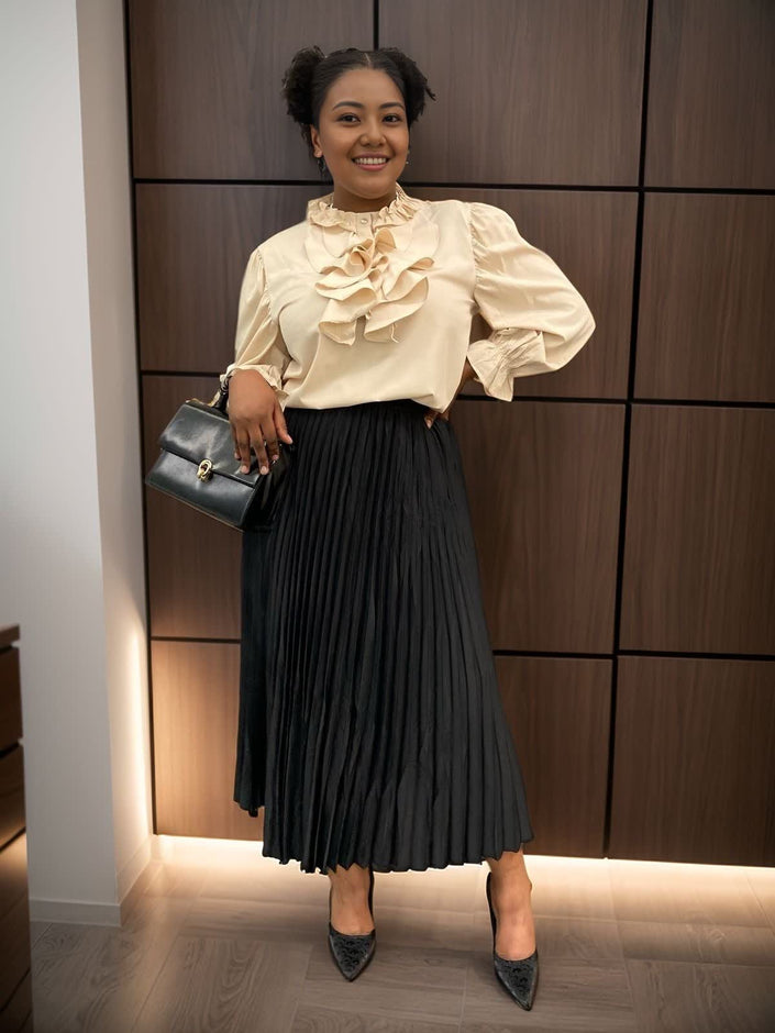 Cream ruffle puff-sleeve blouse with cascading ruffle front and gathered neckline
