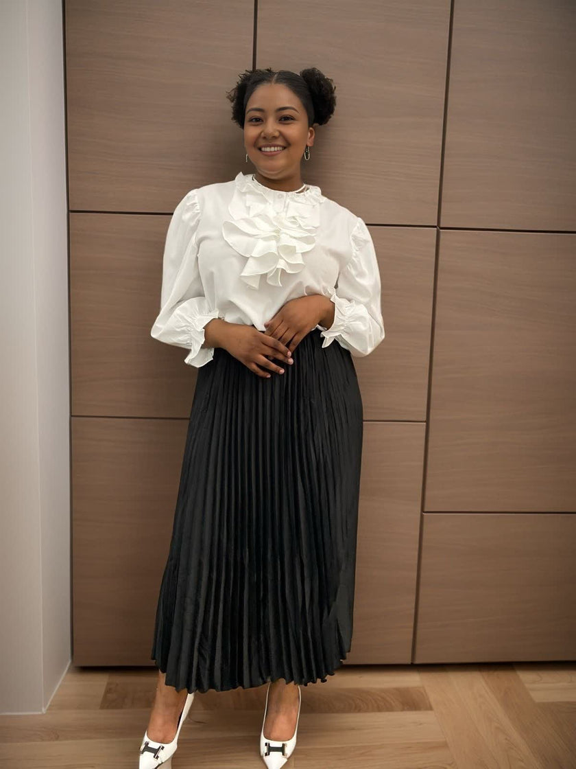White ruffle puff-sleeve blouse with tiered front ruffles and high neckline