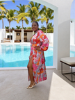 Abstract print wrap maxi dress with long sleeves and side slit, pink/red