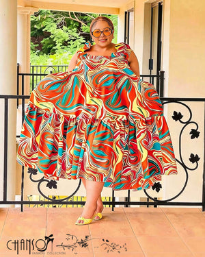 Plus-size midi dress with colorful abstract swirl print, flared skirt and ruffle details