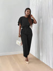 Black short-sleeve top and matching stretch-waist jogger pants set, tied belt
