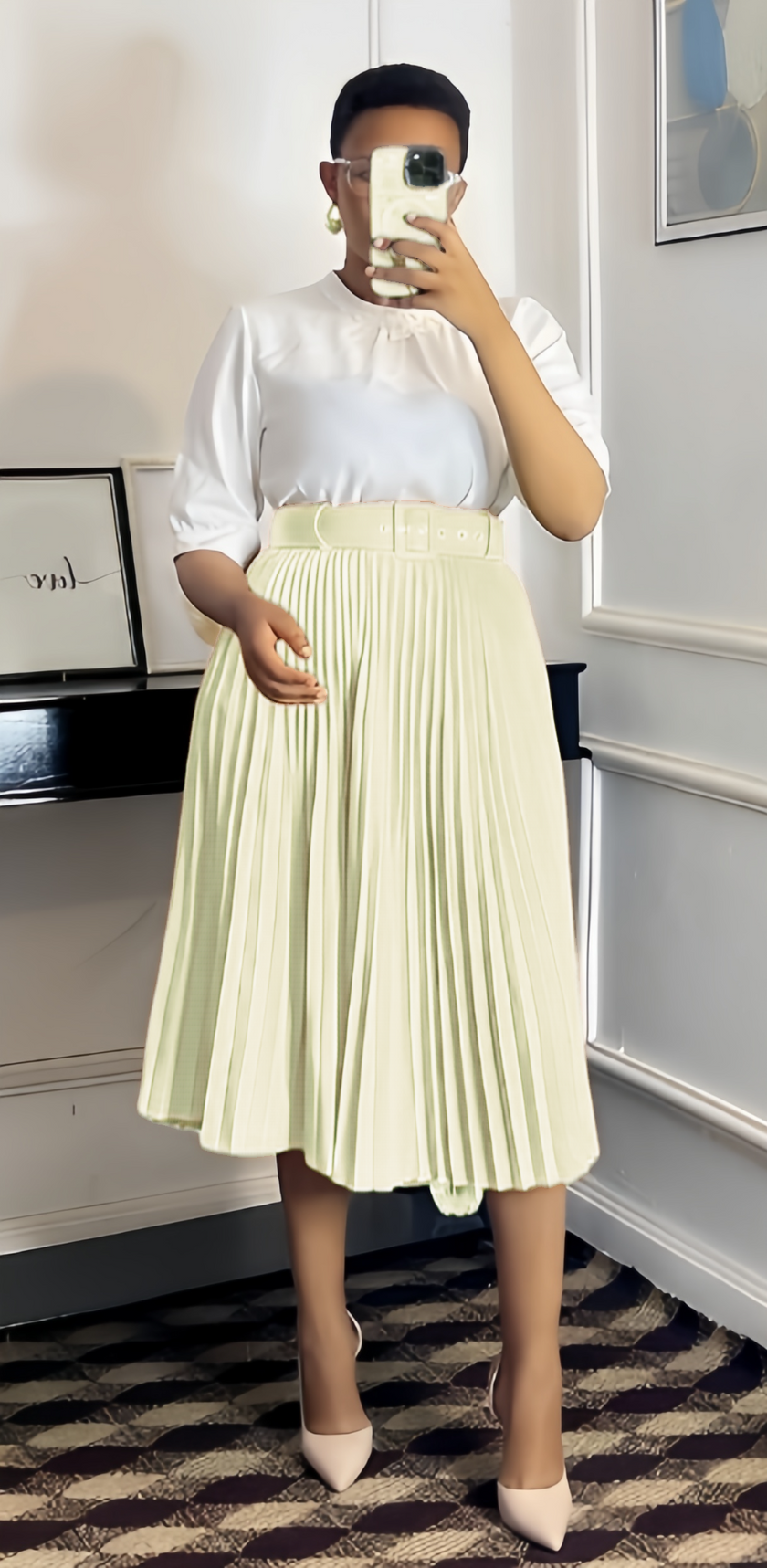 Cream pleated midi A-line skirt with wide belt waistband.