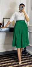 Dark green pleated midi A-line skirt with wide belt waistband.