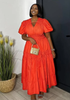 Orange-red tiered maxi dress with puff sleeves and V-neck, gathered waist
