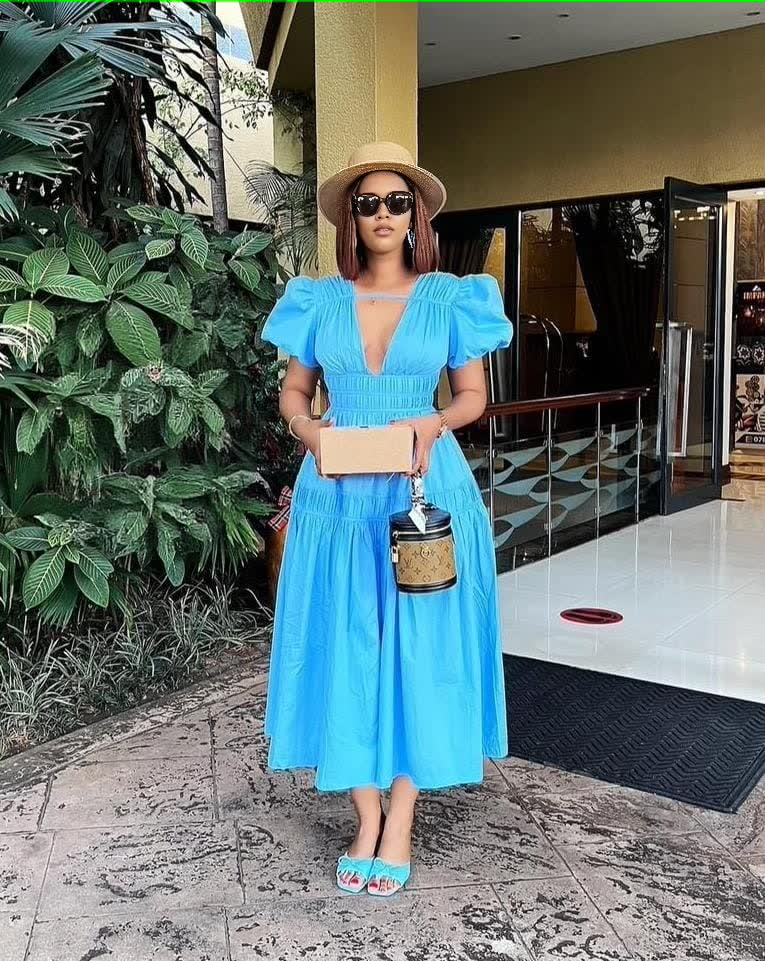 Sky-blue tiered maxi dress with puff sleeves and V-neck, gathered waist