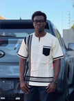 Men's cream short sleeve shirt with tribal inspired black trim and contrast chest pocket