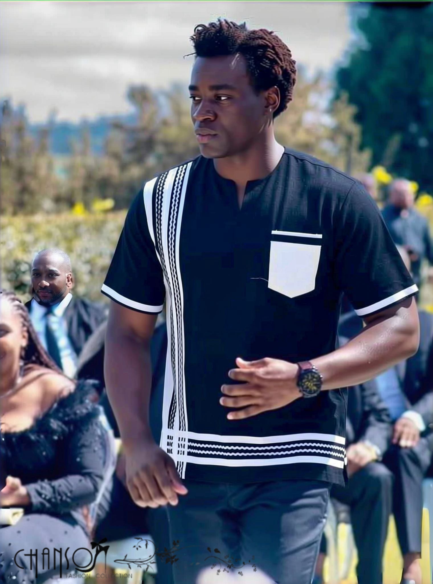 Men's black short sleeve shirt with tribal inspired white trim and contrast chest pocket