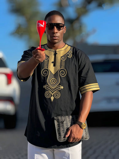 Men's black embroidered short-sleeve top with gold swirl motifs and patterned trim