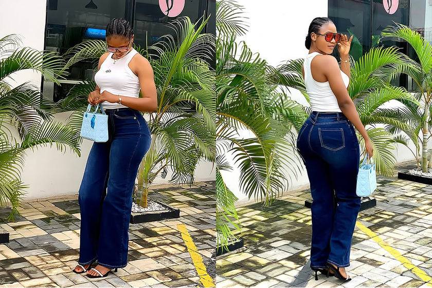 High-waist slim-fit jeans in dark blue, full-length front view