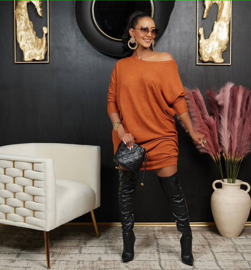 Orange off-shoulder knit dress with loose fit, three-quarter sleeves, curved neckline