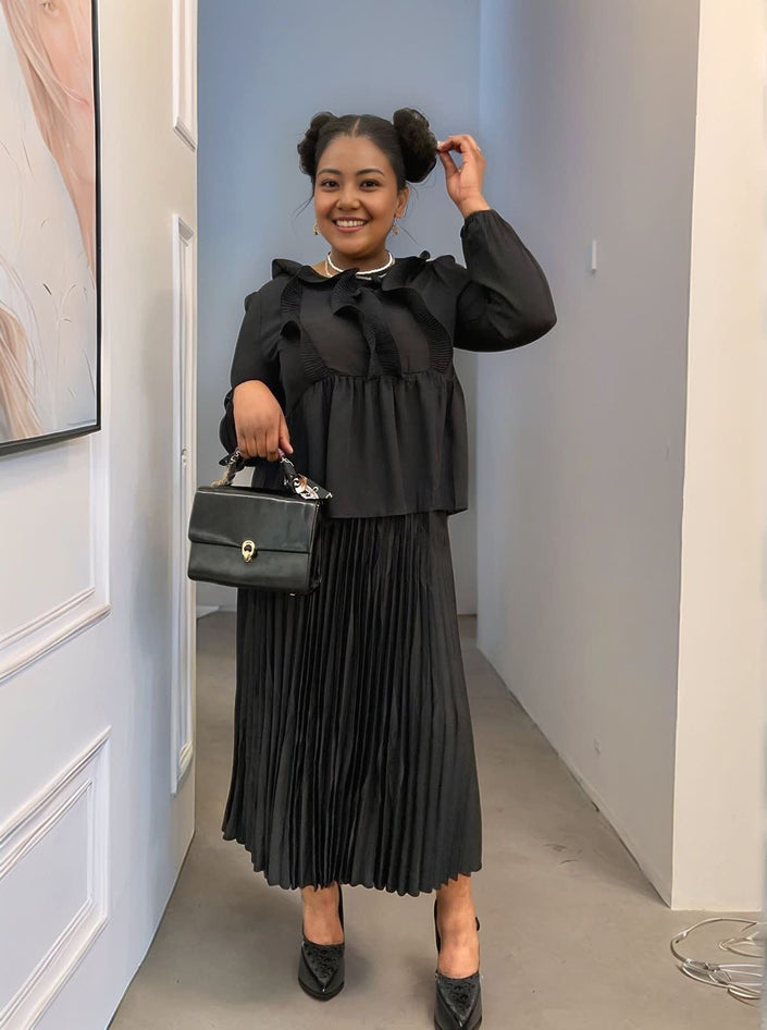 Black cinched waist pleated blouse with ruffle-trim collar and full-length sleeves