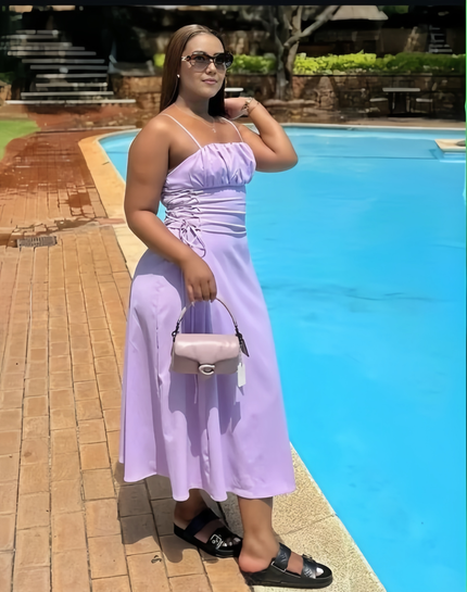 Lilac midi dress with spaghetti straps, ruched bodice, and tied adjustable waist