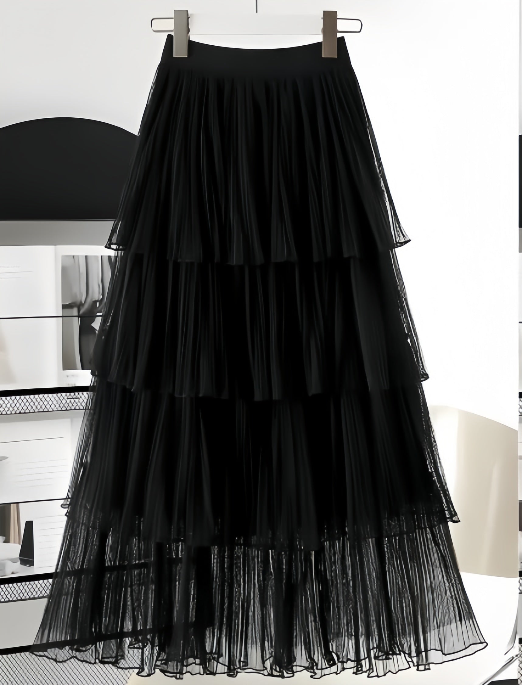 Black layered pleated skirt with stretch waistband and sheer tiered ruffle layers