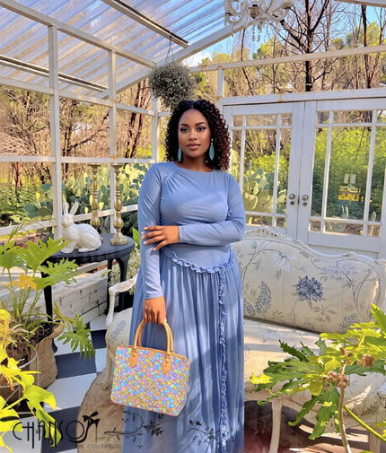 Light blue long-sleeve maxi dress with ruched details and ruffle hem
