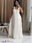 White pleated maxi dress with floral applique straps and open-back detailing