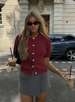 Burgundy maroon short-sleeve knit cardigan top with button front and V-neck