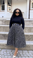 Pleated midi skirt, black with white speckled pattern and adjustable waist