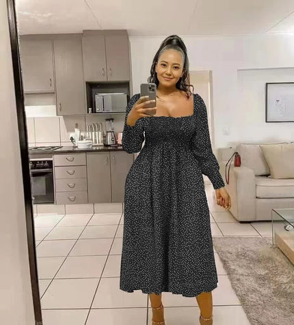 Black polka dot smocked midi dress with puff sleeves