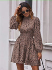 Saddle-brown dotted mini dress with high neckline, puff sleeves, and elastic waist