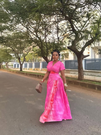 Pink tie-dye maxi dress with V-neck, short sleeves, ruched waist and gathered skirt
