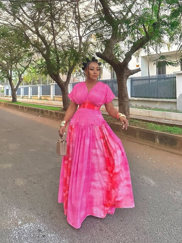 Pink tie-dye V-neck maxi dress with ruched waist, short flutter sleeves, full skirt
