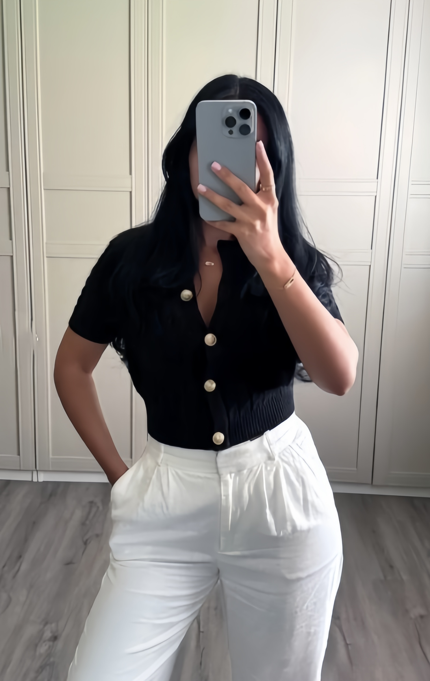 Black short-sleeve knit cardigan top with button front and ribbed texture