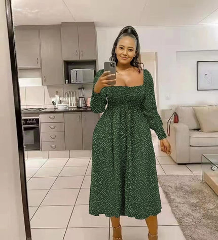 Green polka dot smocked midi dress with puff sleeves