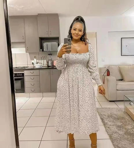 White polka dot smocked midi dress with puff sleeves