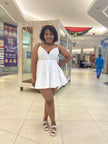 White ruffle V-neck mini dress with adjustable spaghetti straps
