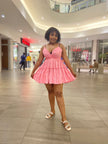 Pink ruffle V-neck mini dress with adjustable spaghetti straps, tiered skirt
