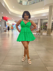 Green ruffle V-neck mini dress with adjustable spaghetti straps, layered tiers