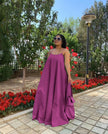 Purple maxi dress with adjustable spaghetti straps, sleeveless, gathered flared skirt