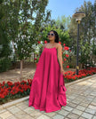 Hot-pink maxi dress with adjustable spaghetti straps, sleeveless, gathered flared skirt
