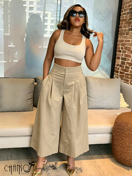 Beige wide-leg culottes with pleats, stretch waist, and button front detail