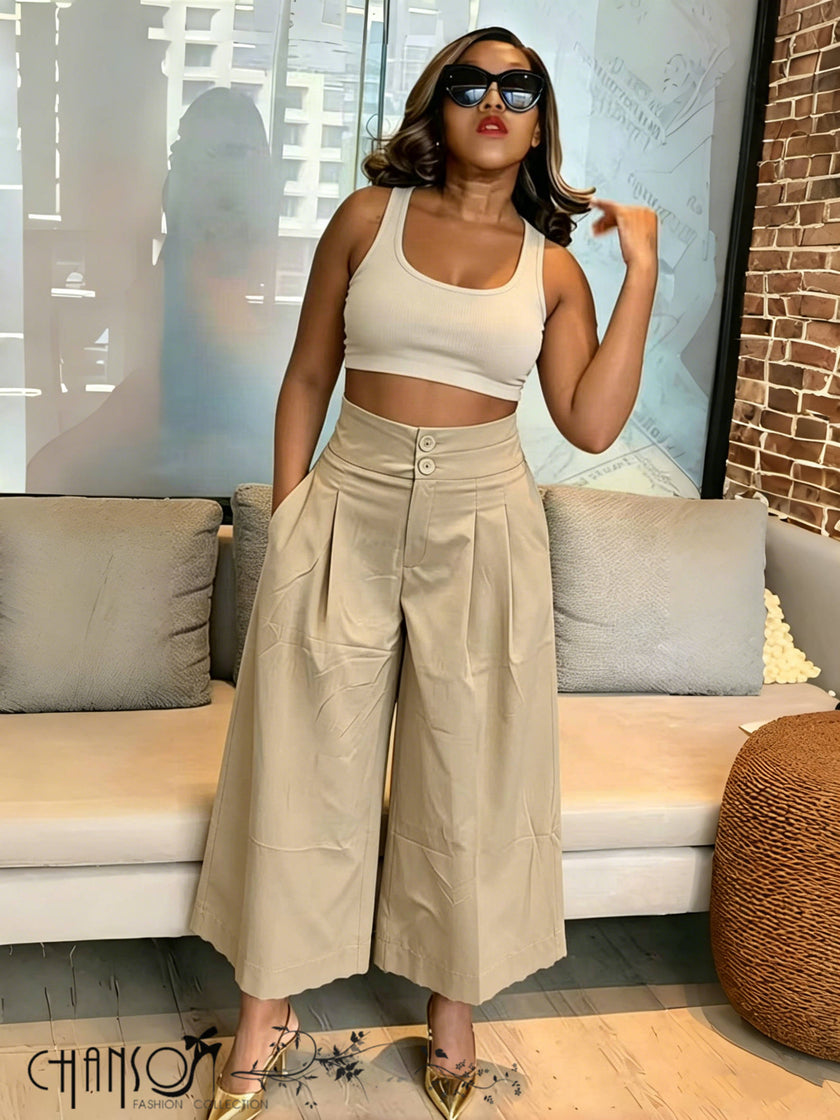 Beige pleated wide-leg culottes with stretch waistband, side drape detail.