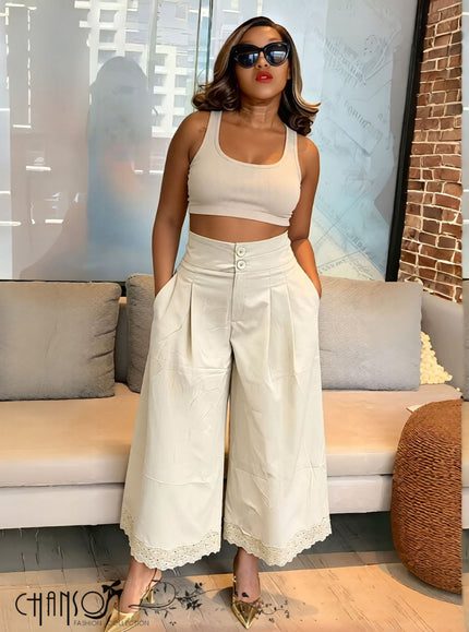 Beige pleated wide-leg culottes with stretch waistband and button front