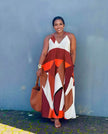 Geometric maxi dress with V-neck and thin straps, red and white abstract pattern