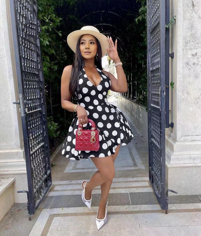 Black polka dot mini dress, sleeveless V-neck with flared skirt