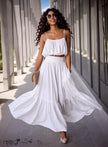 White spaghetti-strap crop top with ruffled tiers and flowing maxi skirt