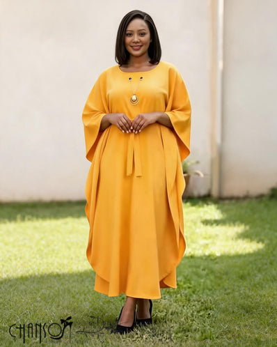 Yellow loose-fit midi dress with batwing sleeves and round neckline, small button detail