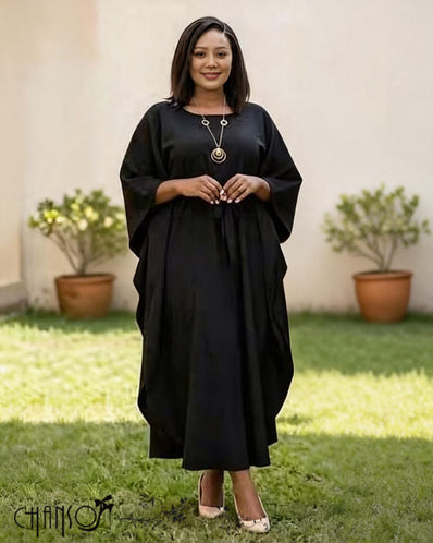 Black loose-fit midi dress with batwing sleeves and round neckline, small button detail