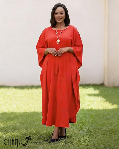 Red loose-fit midi dress with batwing sleeves and round neckline, small button detail