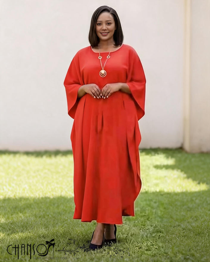 Red loose-fit midi dress with batwing sleeves and round neckline, small button detail