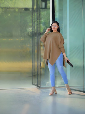 Coffee-brown asymmetrical knit top with loose fit and wide 3/4 sleeves