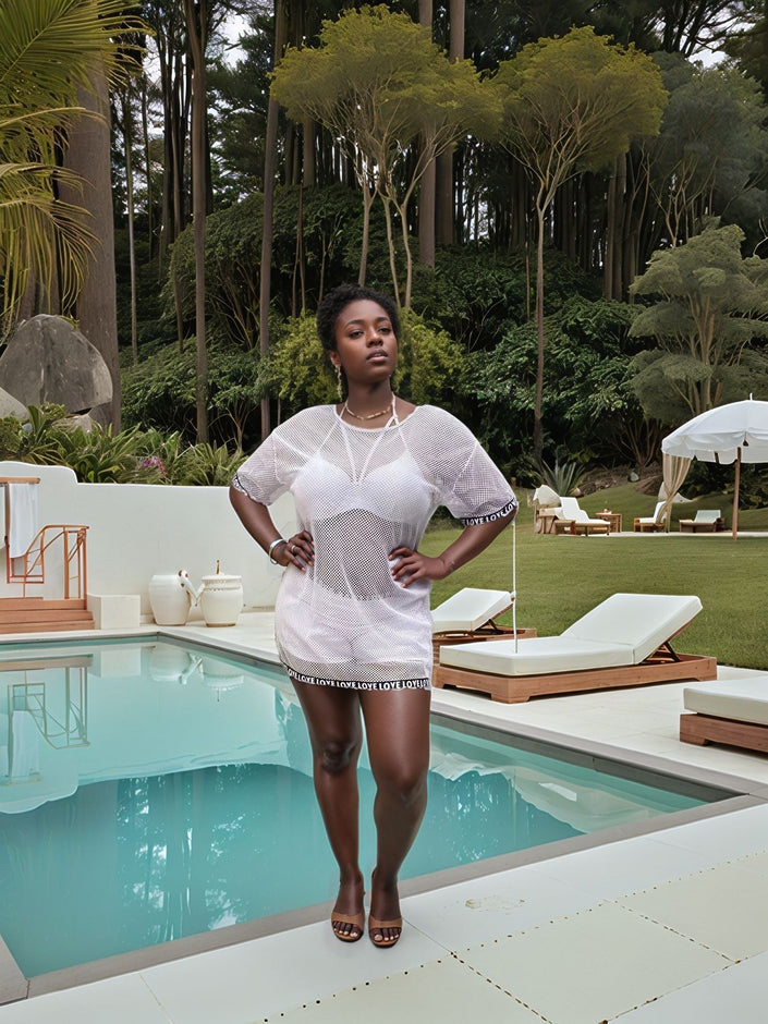 White sheer mesh coverup over bikini with short skirt