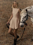 Peach sleeveless A-line mini dress with round neckline and flared skirt