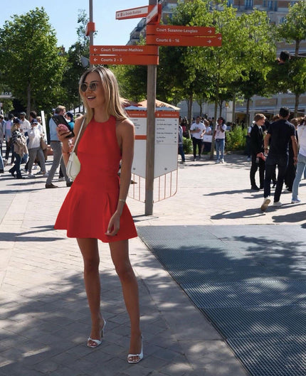 Red sleeveless A-line mini dress with round neckline and gathered flared skirt