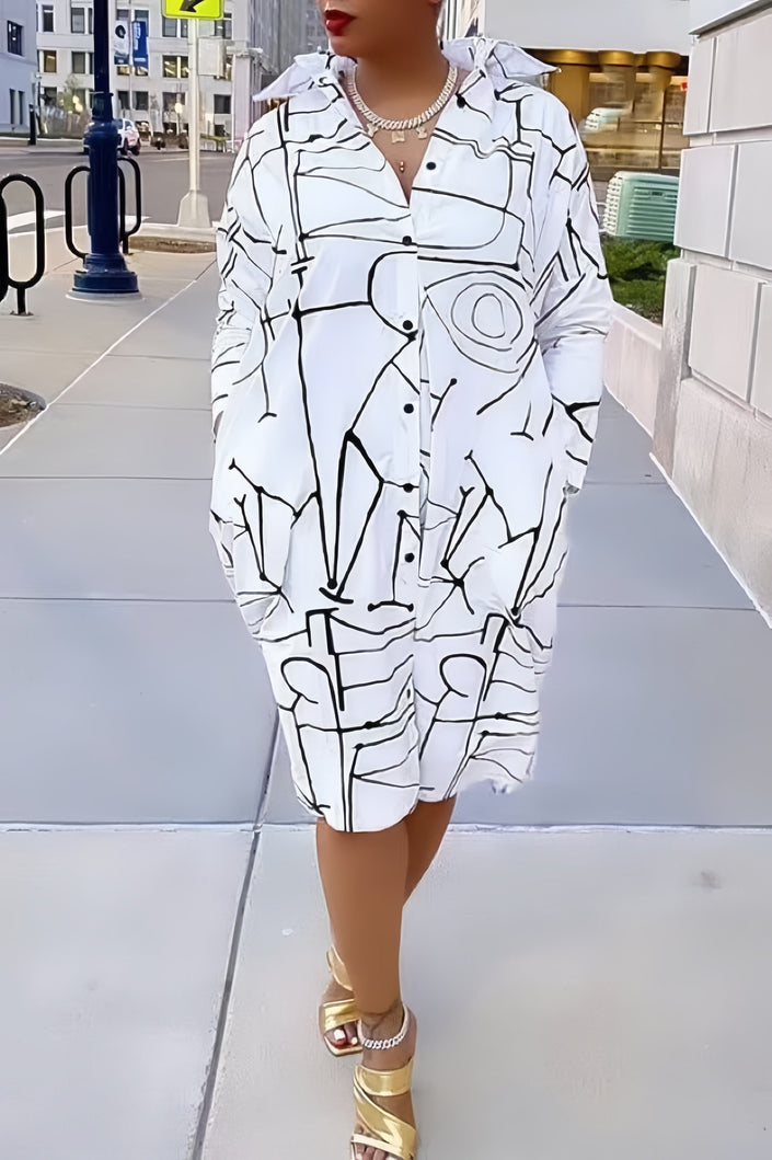 Geometric shirt dress with black line pattern, long sleeves, button front, collared neckline