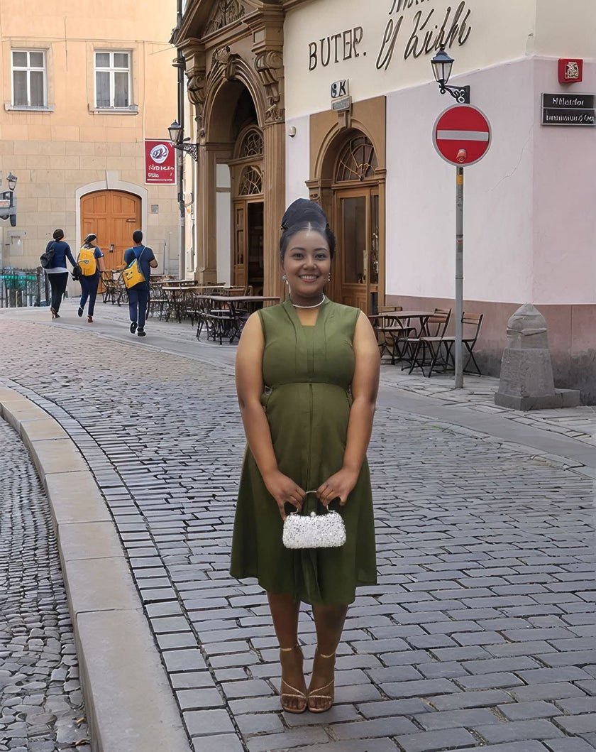Army-green sleeveless midi utility dress with front pockets and fitted waistband