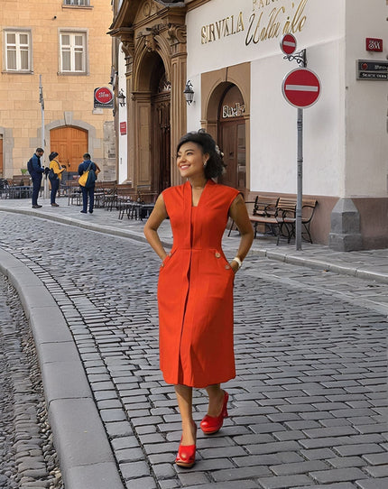 Sleeveless midi utility dress, orange-red with front seams and pockets